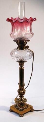 A Victorian brass column oil lamp