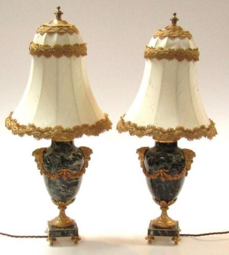 A pair of 20thC black marble baluster table lamps