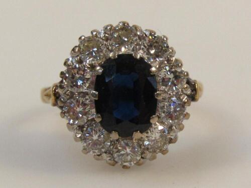 A ladies eleven stone sapphire and diamond cluster ring