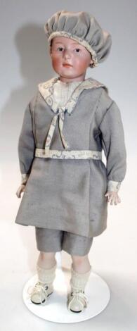 A late 19thC/ early 20thC bisque headed male doll
