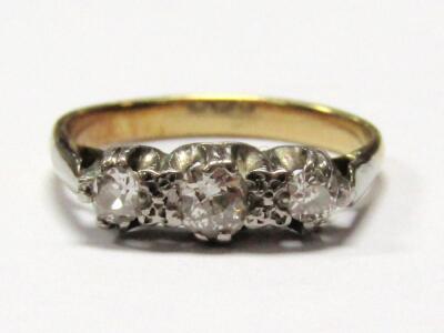 A ladies graduated three stone dress ring