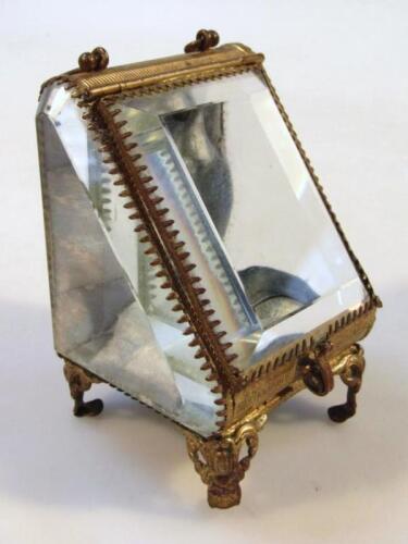 A glass pocket watch casket