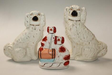 A pair of Victorian Staffordshire his and her fireside spaniels