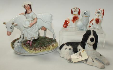 A late 19thC Staffordshire cow and milk maid group