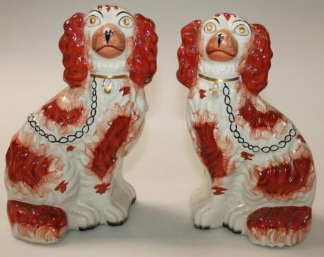 A pair of late 19thC/early 20thC Staffordshire spaniels