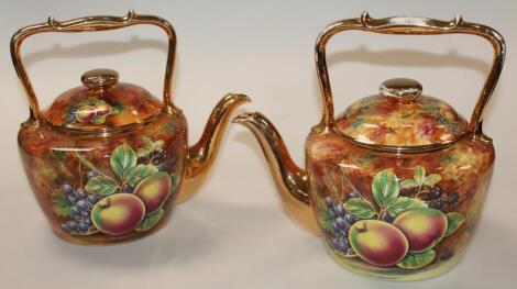 A near matching pair of 20thC Baroness Pottery kettles