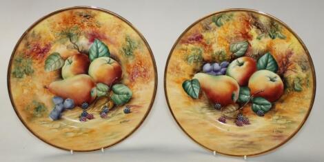 A pair of 20thC bone china cabinet plates