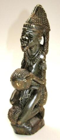 A 20thC African polished stone tribal beaded figure