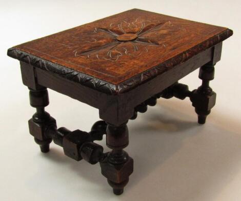 An early 20thC oak stool