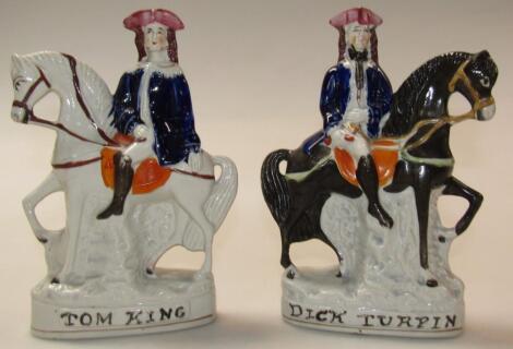 A pair of Staffordshire pottery figures