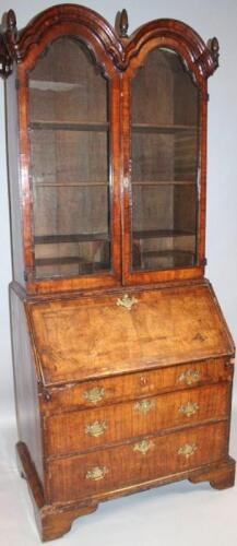 A Queen Anne walnut double dome top bureau bookcase