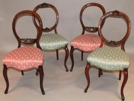 A pair of Victorian mahogany open spoon back dining chairs