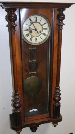 A late 19thC walnut cased Vienna wall clock