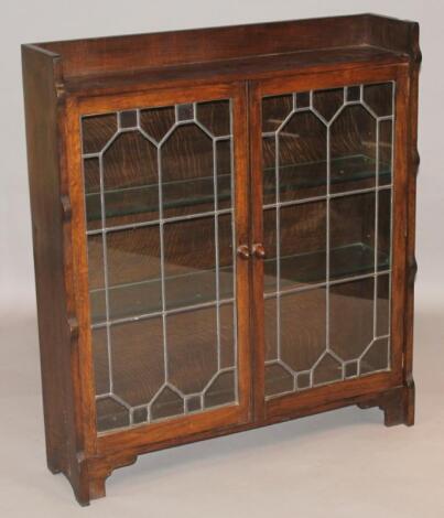 A 20thC Ercol style oak finish display cabinet