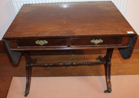 A reproduction mahogany sofa table