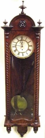 A 19thC painted walnut cased Vienna wall clock