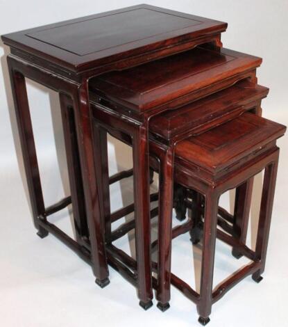 A nest of 20thC Chinese design hardwood tables