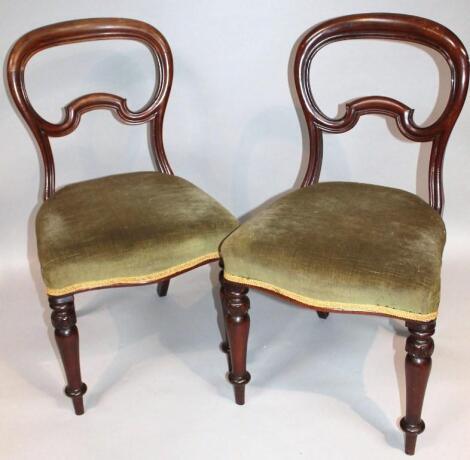 A pair of Victorian mahogany balloon back dining chairs