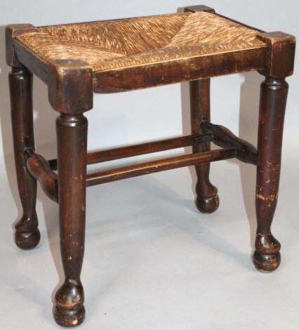 An early 20thC oak stool