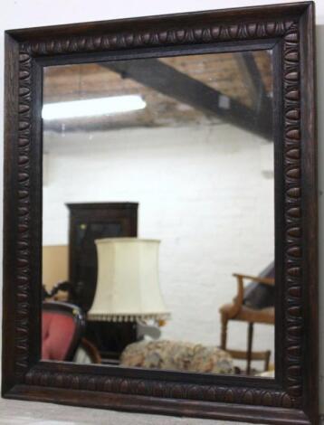 A mid-20thC oak mirror