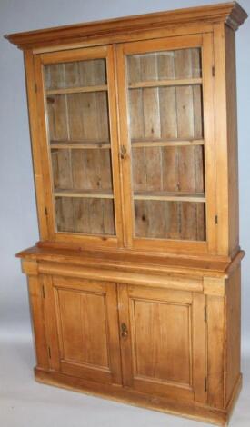 A stripped and lightly polished pine bookcase