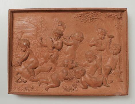 An early 20thC hard baked stoneware plaque