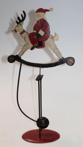 A 20thC articulated Father Christmas toy