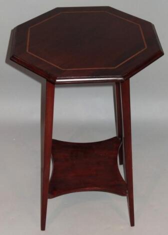 An Edwardian mahogany window table