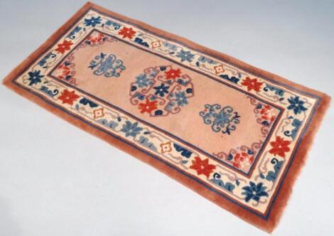 A 20thC wool hearth rug