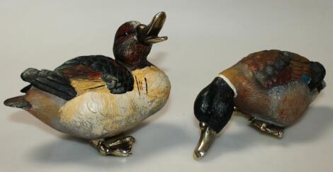 A pair of resin duck ornaments