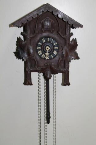 An early 20thC Black Forest wooden cuckoo clock