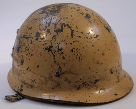 A 20thC painted war helmet