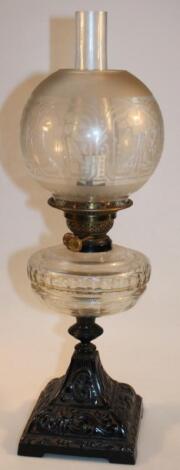 An Edwardian metal frame oil lamp