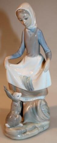 A 20thC Lladro figure of a maid