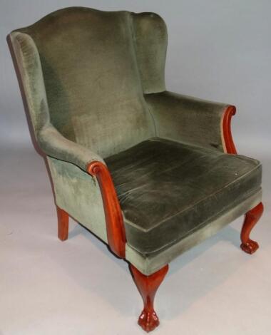 A 20thC George III style wing armchair