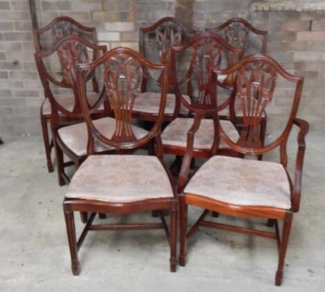 A set of seven (6+1) 20thC mahogany Hepplewhite design shield back boardroom chairs