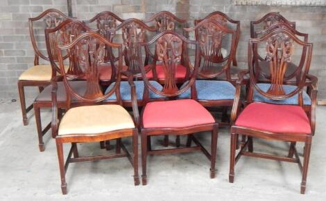 A set of twelve (10+2) Hepplewhite design mahogany shield back boardroom chairs