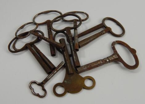 Nine antique steel clock keys