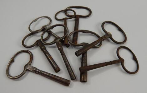 Nine antique steel clock keys