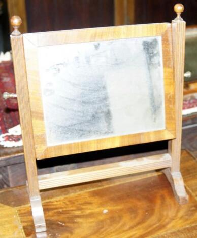 A small mahogany rectangular toilet mirror