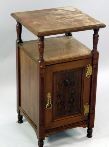 An Edwardian walnut bedside cabinet