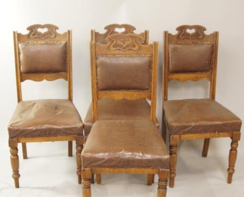 A set of four Edwardian oak dining chairs