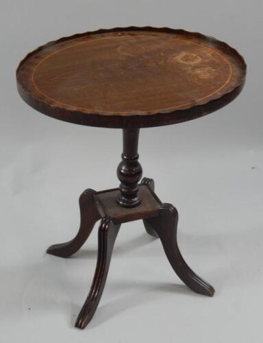 A reproduction mahogany Regency style oval occasional table.