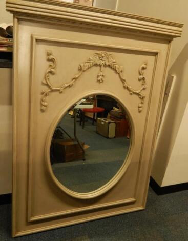 A decorative bevelled oval wall mirror