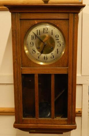 An oak cased eight day mantel clock