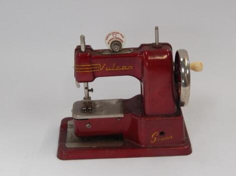 A Vulcan Senior toy sewing machine.