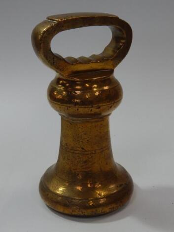 A vintage brass 14lb weight