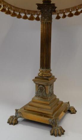 A brass Corinthian column table lamp