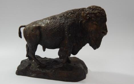 A modern bronze patinated model of a standing buffalo