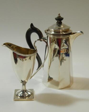 A late Victorian plain silver helmet shaped cream jug